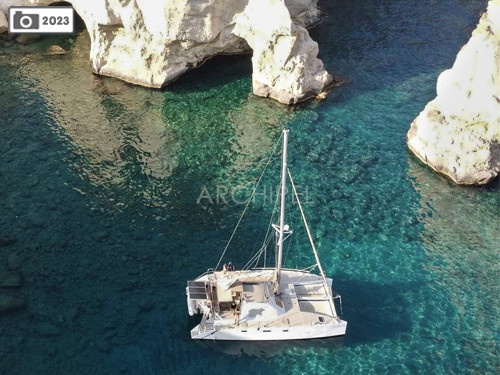 The spectacular landscapes of the island of Milos. Enjoying swimming from the boat in its translucent waters.