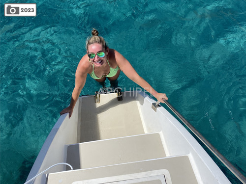 Swimming from the skirt of the boat. Getting in and out of the water has never been so easy thanks to the comfortable steps and ladder.